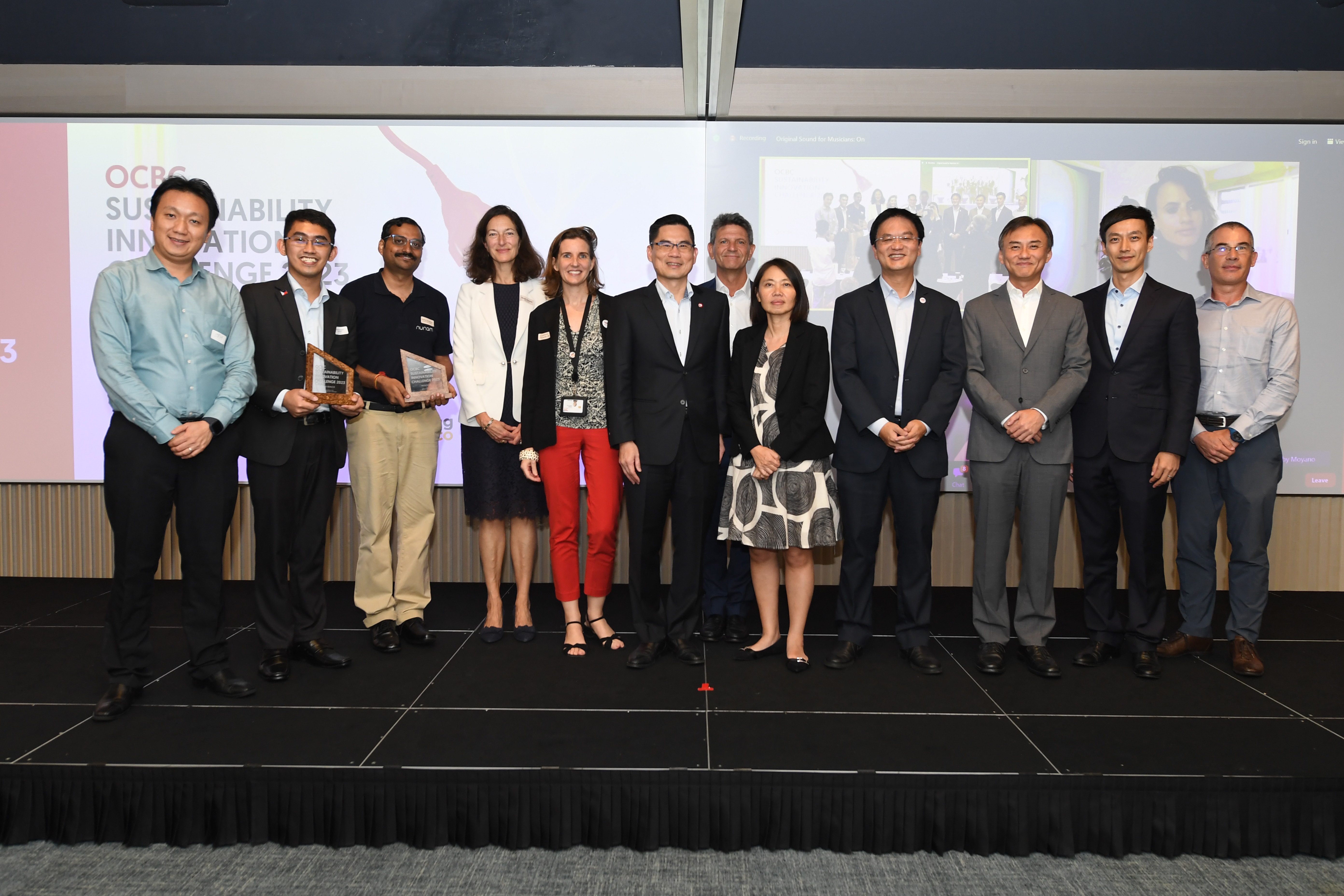 Winners of the OCBC Sustainability Innovation Challenge 2023 with Mr Steve KYAW, Head and Managing Director, Hutchinson Research and Innovation Singapore (first from left); Ms Elodie RENAUD, Managing Director, TotalEnergies Renewables Distributed Generation Asia (fifth from left); Mr Tan Teck Long, Head of Global Wholesale Banking, OCBC (sixth from left); Mr Franck Vitte, Managing Director, TotalEnergies Charging Services Singapore (seventh from left); Her Excellency Ms Minh-di Tang, the Ambassador of France to Singapore (eighth from left); Mr Ting Wee LIANG, Country Chair Singapore and President, TotalEnergies Asia-Pacific & Middle East Marketing & Services (ninth from left) and Mr Mike Ng, Group Chief Sustainability Officer, OCBC (tenth from left)