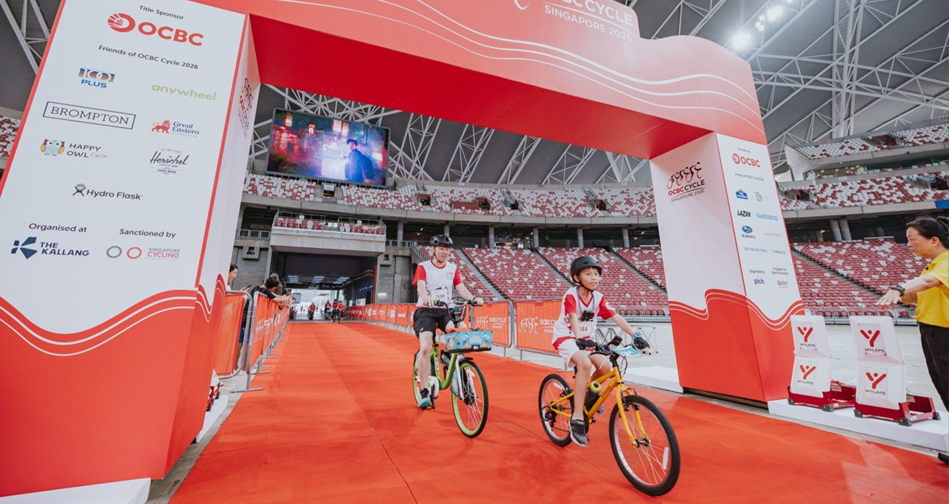 Families cycled into the National Stadium for the first time as part of the Mighty Savers&reg; Kids Ride at OCBC Cycle 2026 (Photo Credit: OCBC Cycle)