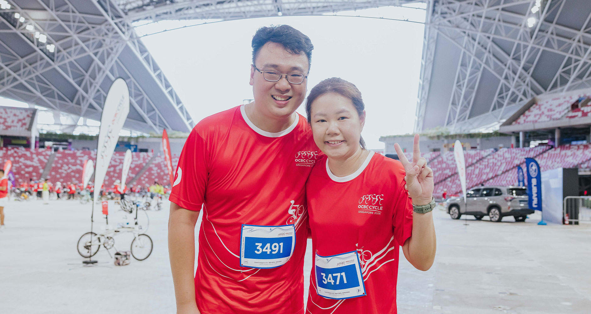 Ms Apple Tan, 34 with her husband, Li Bingzhao, 37 after completing The Straits Times Ride (Photo credit: OCBC Cycle)