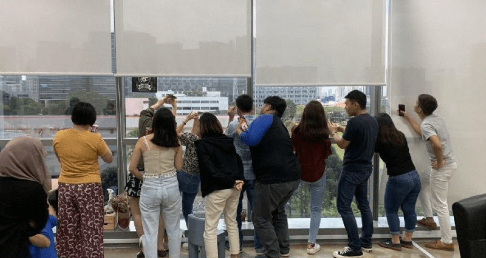 Group of people gathering in the office